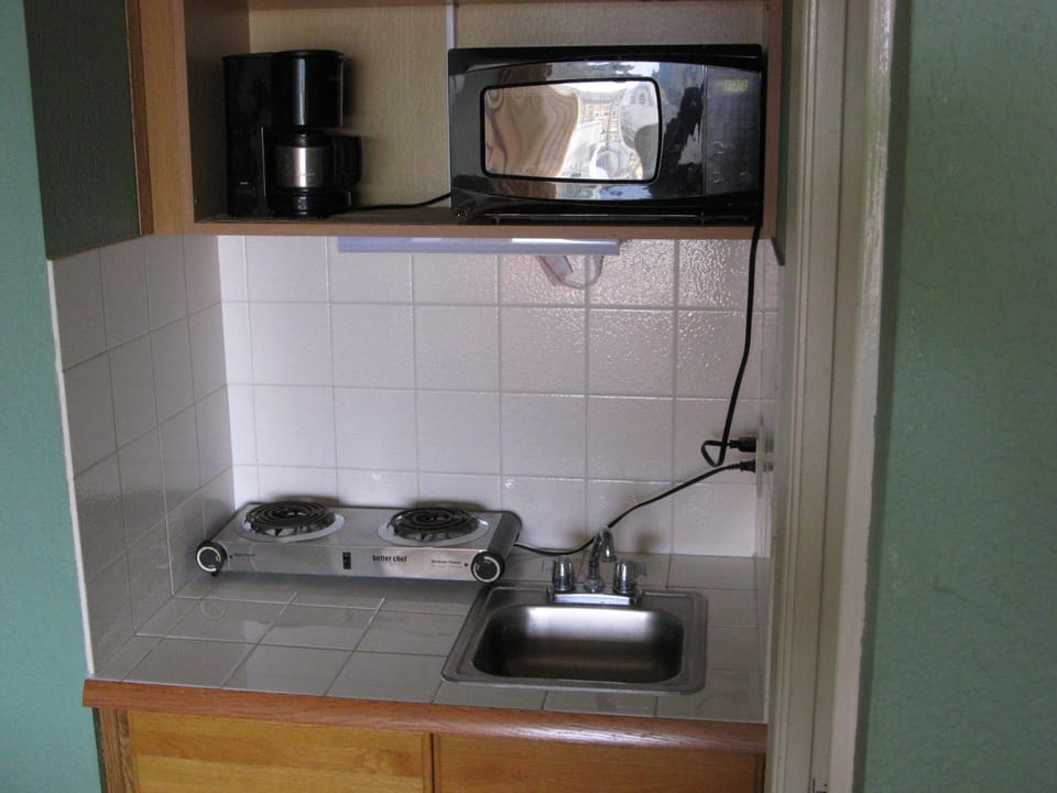 Hot and cold water,  with a sink will help to to cook a meal and maintain dishes