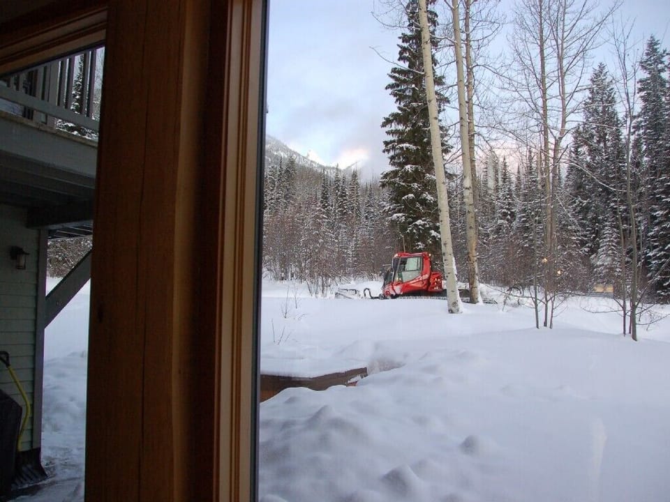 Snow cat grooming Hot tub out back door with snow cat grooming Ski trail to home