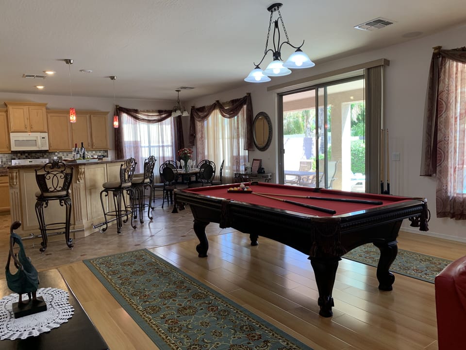 Family/entertainment room with billiard.