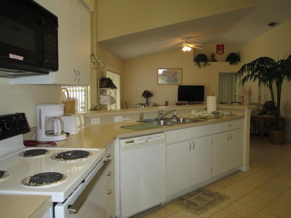 Watch what everyone is doing from the kitchen or just watch TV as cooking