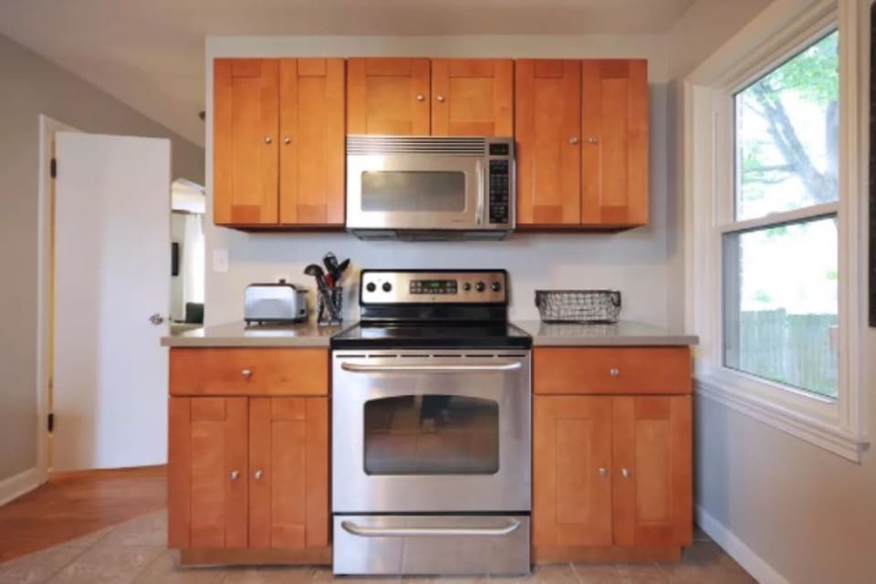 It includes a gas stove, microwave, fridge, coffee maker, etc.