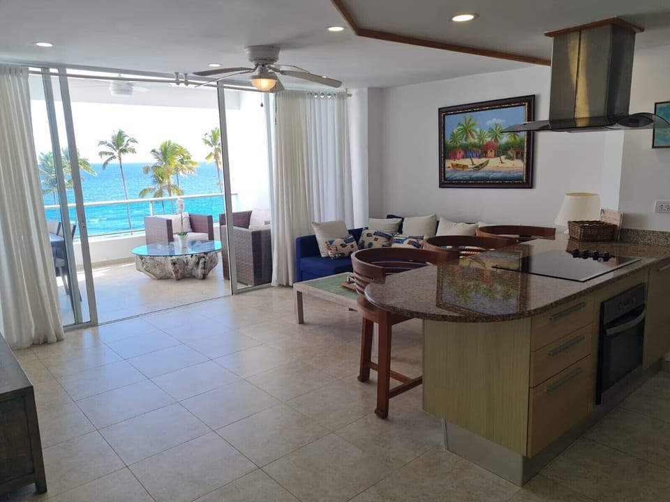 Seating room and the balcony overlooking the beach and the ocean