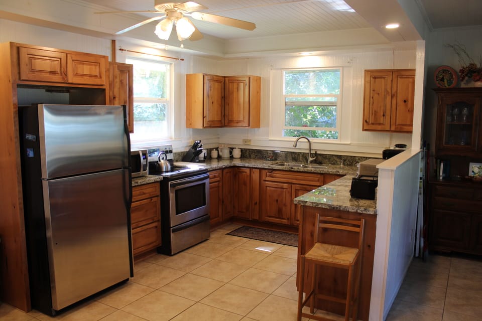 New kitchen with new appliances and gas stove.
