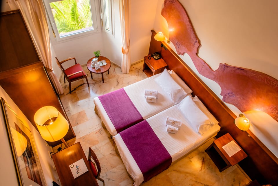 Triple Room | In-room safe, desk, blackout drapes, iron/ironing board