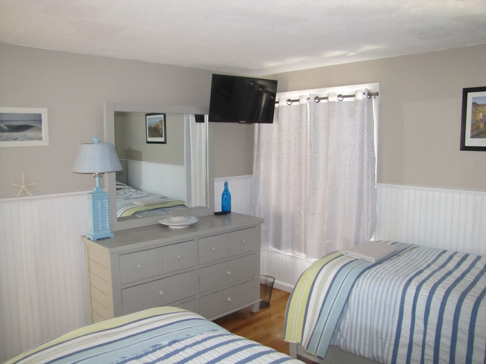 Bedroom downstairs offers comfort plus!  Mounted flat screen.