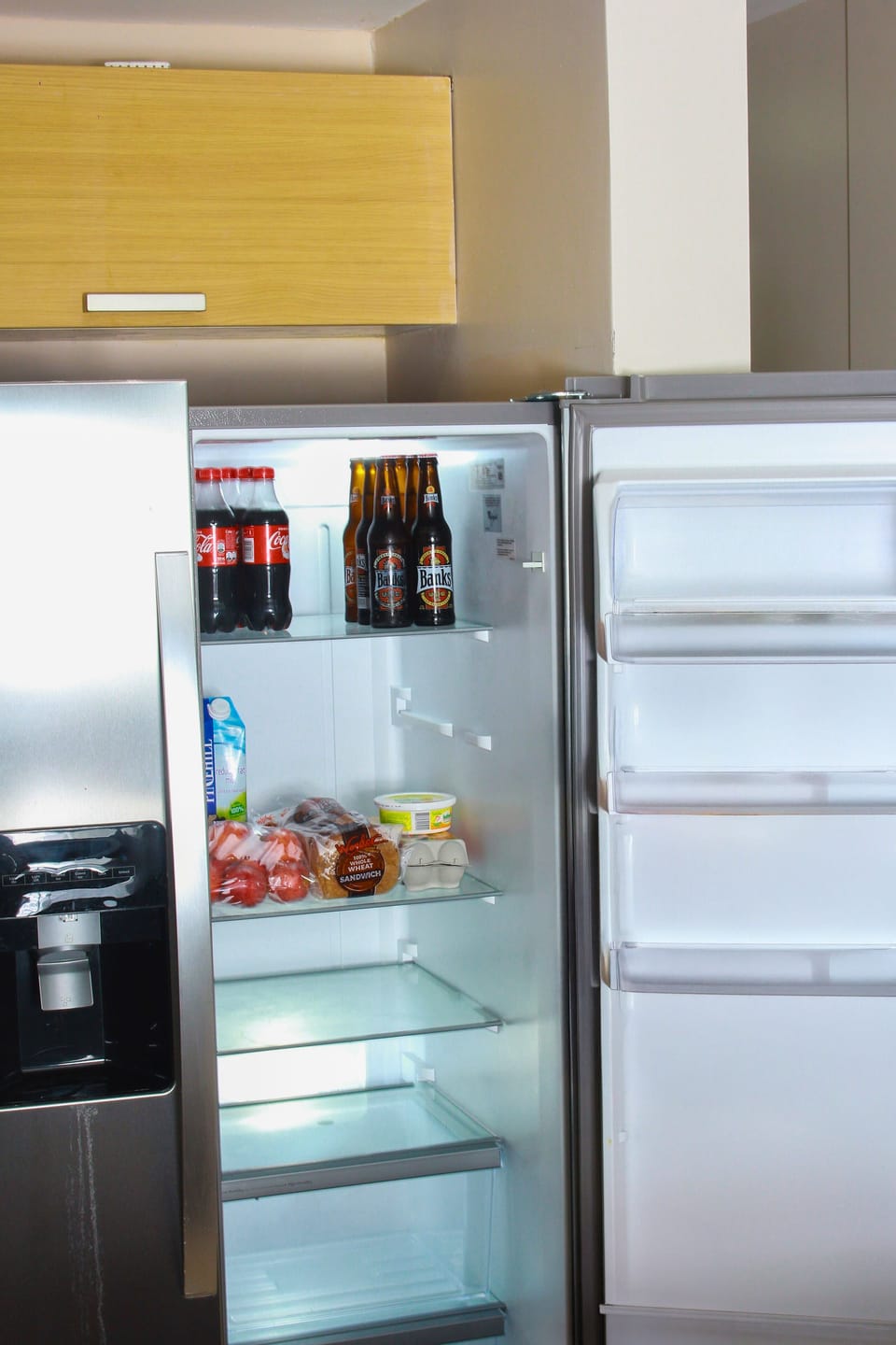 A fridge in the kitchen with a grocery to start your vacation.