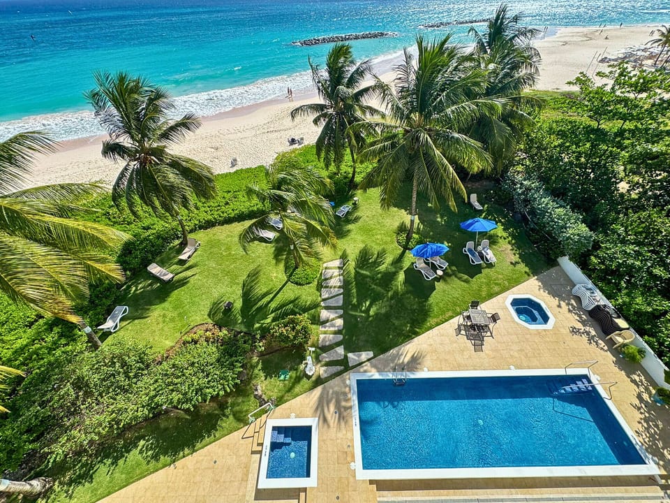 Refreshing outdoor swimming pool surrounded by lounge chairs.