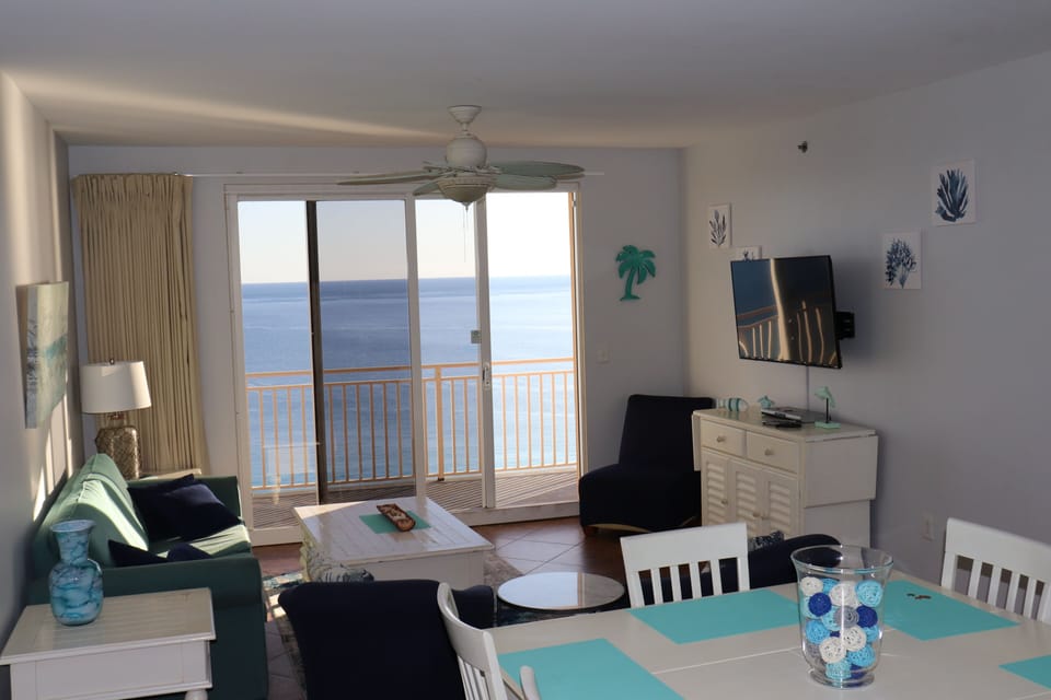 Comfortable Beachfront Living Room with Large Wall Mounted Flatscreen TV