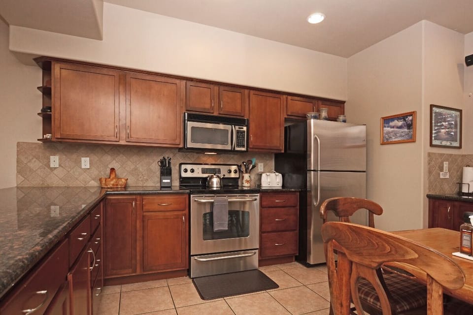 Kitchen with Stove, Microwave, and Refrigerator 