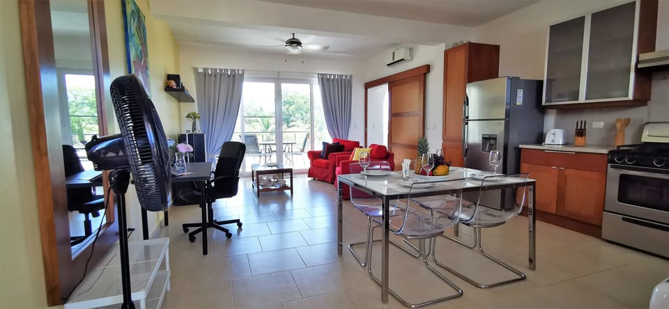 The large open space features, the living room, the  dining area and the kitchen