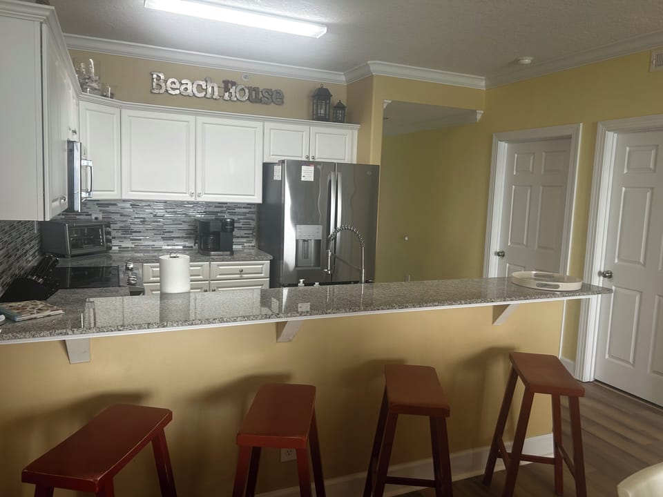 A photo of the kitchen bar counter which provides extra seating