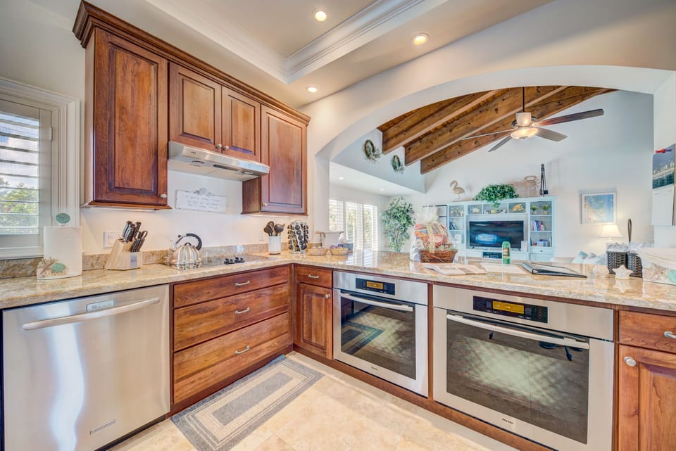Double-oven kitchen, looking over breakfast/lunch counter to family room