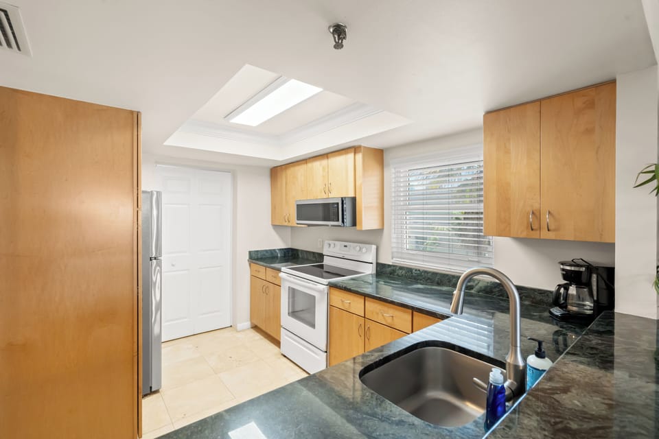 Modern kitchen with all your appliances, utensils, and serving items 