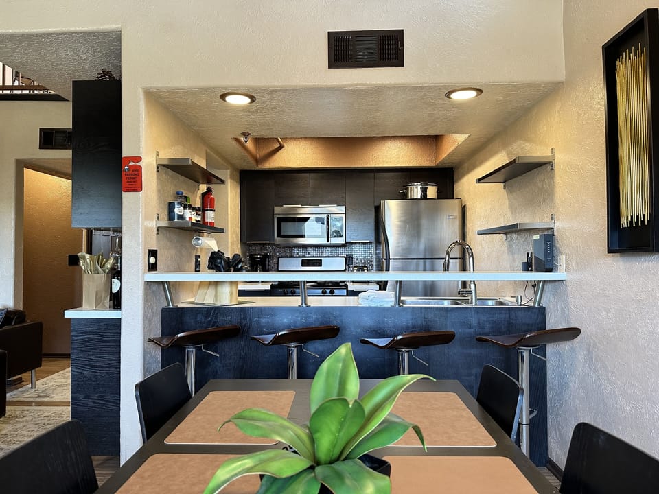 View from dining area facing kitchen bar