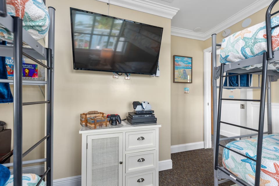 PS4 and xbox One gaming consoles in bunk bed bedroom