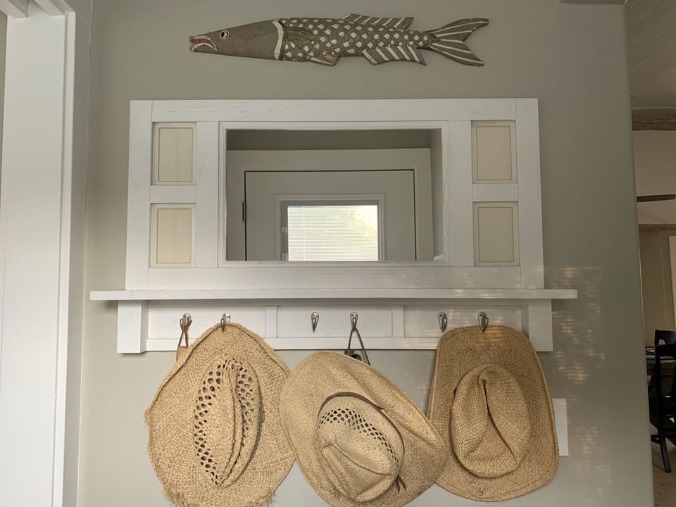 Straw cowboy hats hanging by the back door Country life VineyardVista Healdsburg
