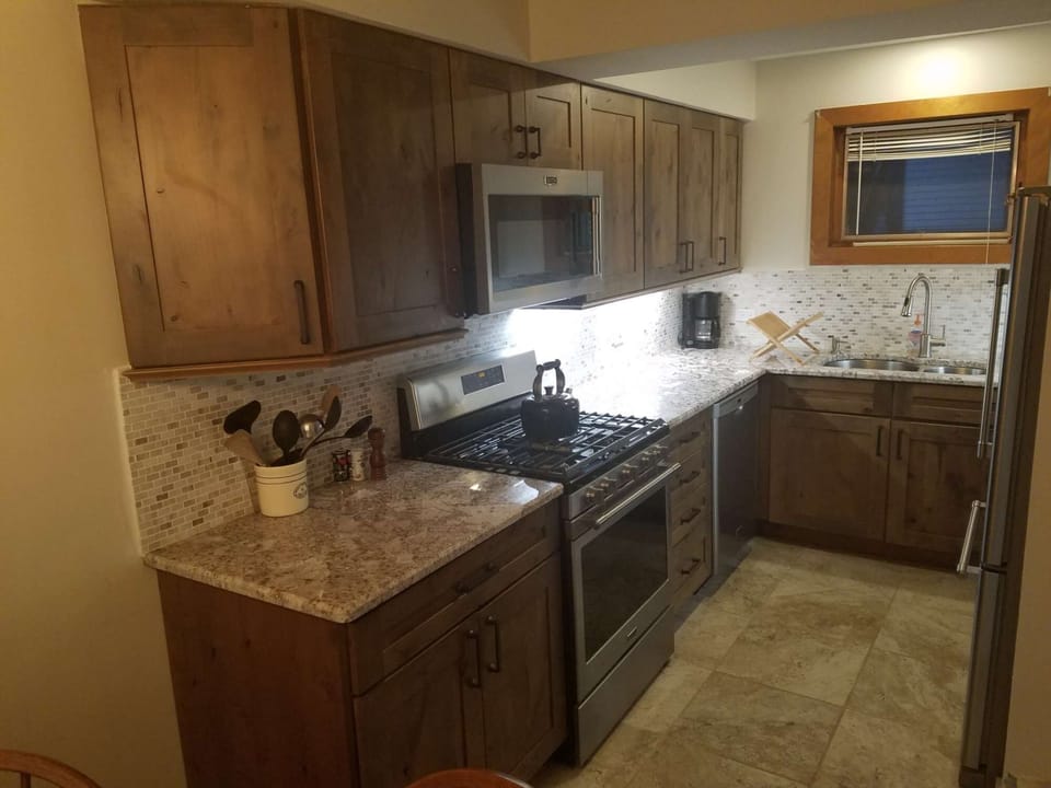 Updated kitchen with dishwasher, refrigerator, oven, microwave