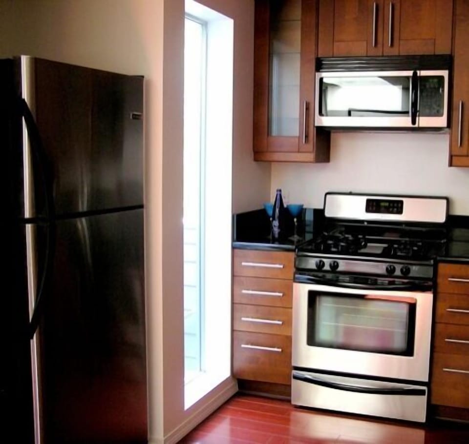 The Large Window spills Light into the Kitchen and looks out onto the entry