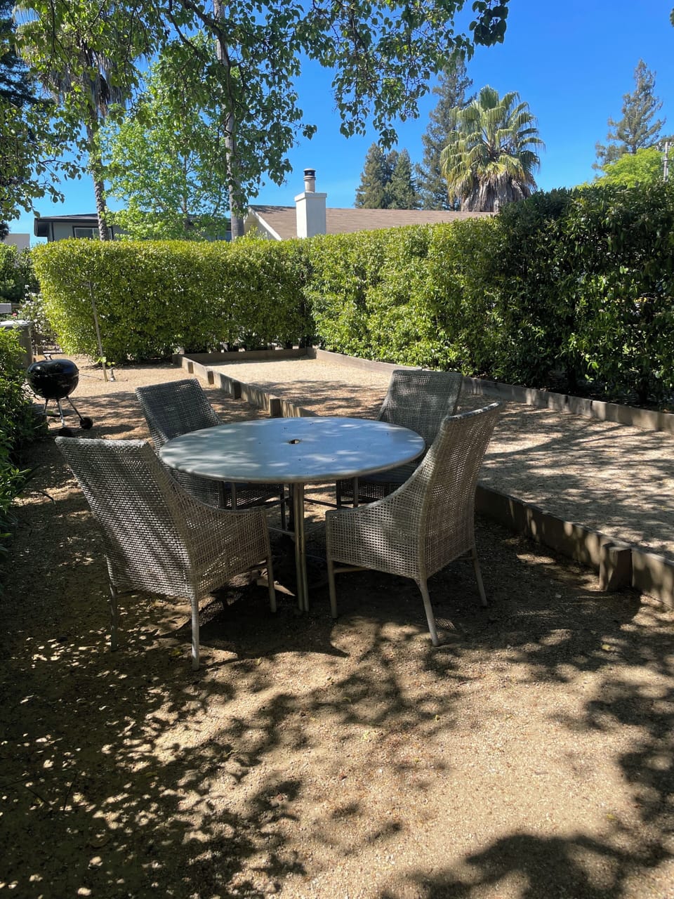 Table and chairs by Bocce Court
