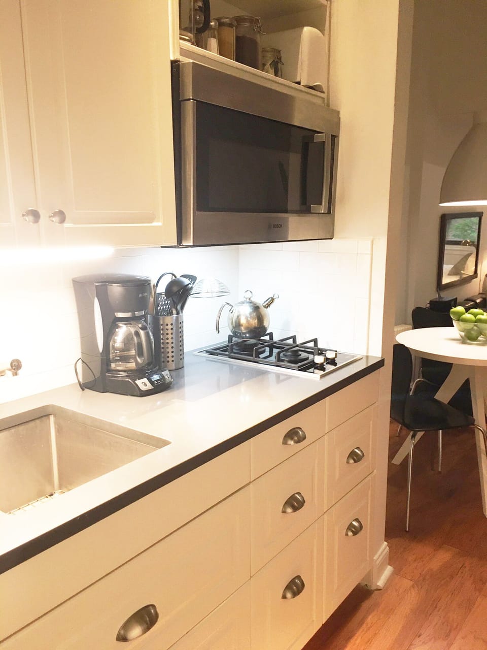 Quartz countertop, gas burners and new convection microwave oven.