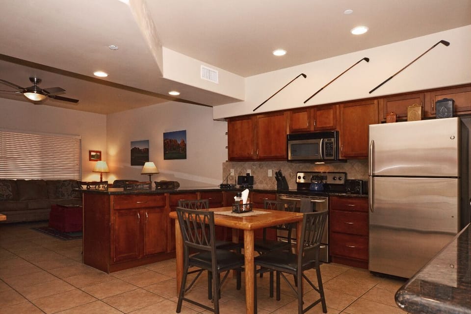Kitchen with Stainless Steel Appliances, Granite Counter tops and Table for  4