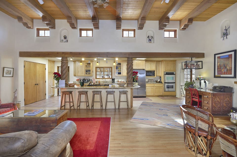 Looking from very large great room to fully equipped Kitchen. Large work desk.