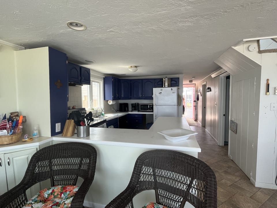 Kitchen with bathroom door on right