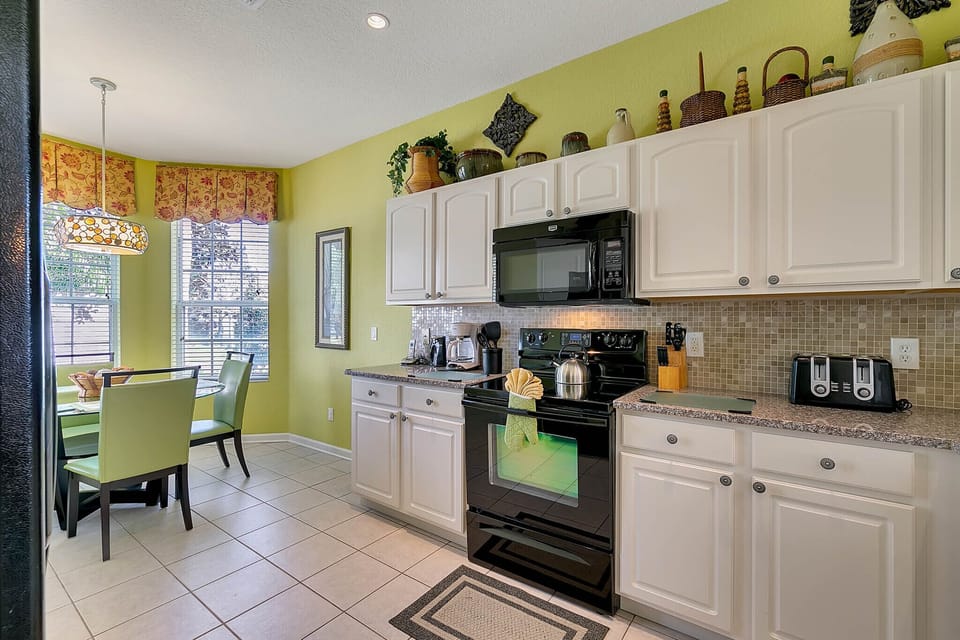 Kitchen features new appliances and granite countertops