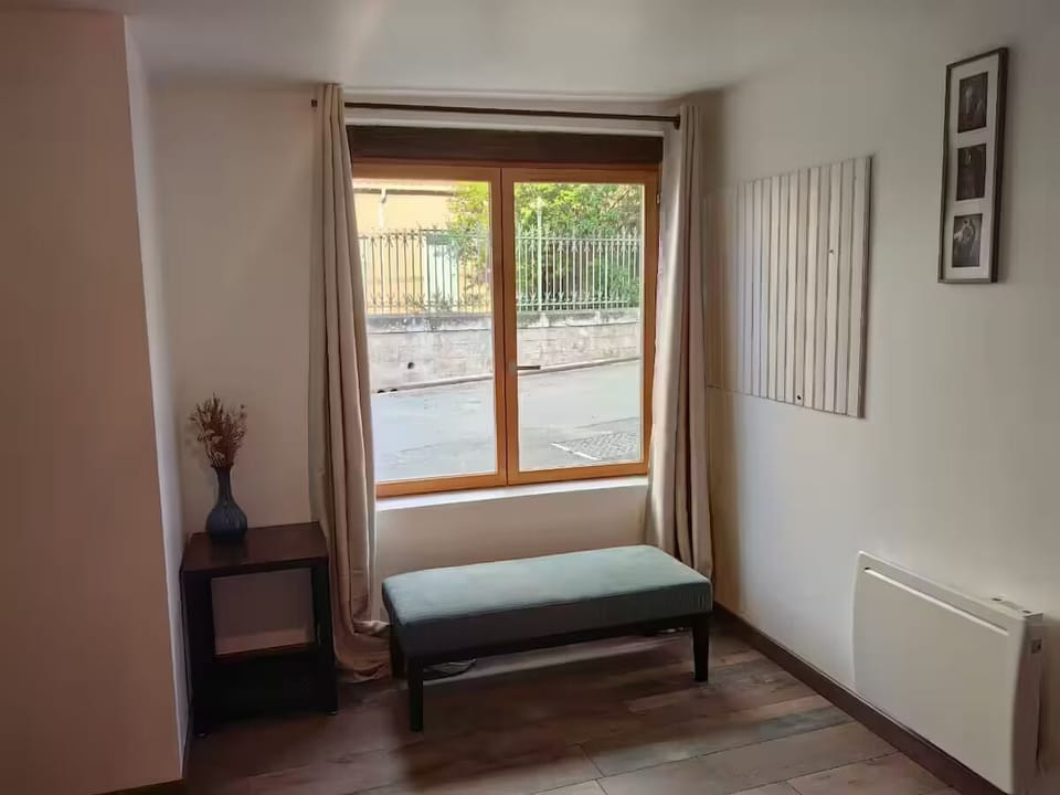 Living room with window looking onto the street