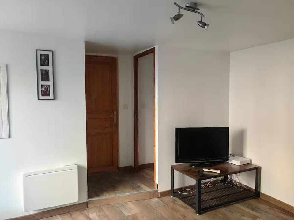 Living room with TV and internet.  Downstairs toilet on the right.
