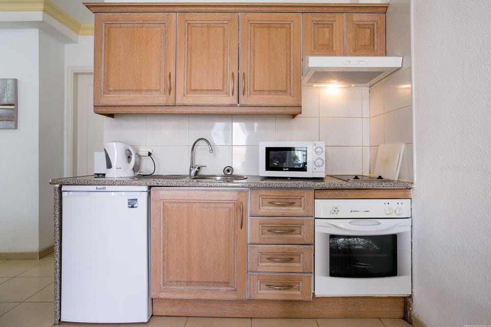 Kitchen with oven hob microwave kettle aand toaster