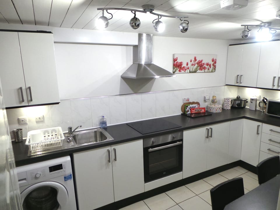Massive Modern kitchen with plenty of storage space and breakfast bar.