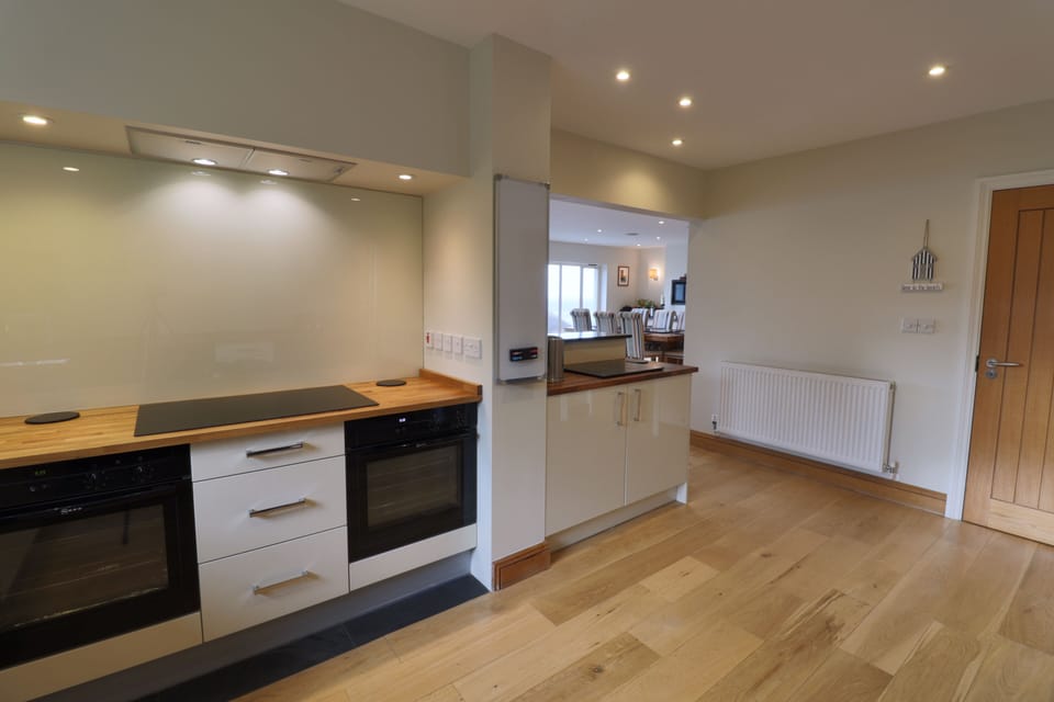 Well equipped kitchen with 5 ring induction hob, Miele warming drawer, 2 Ovens.