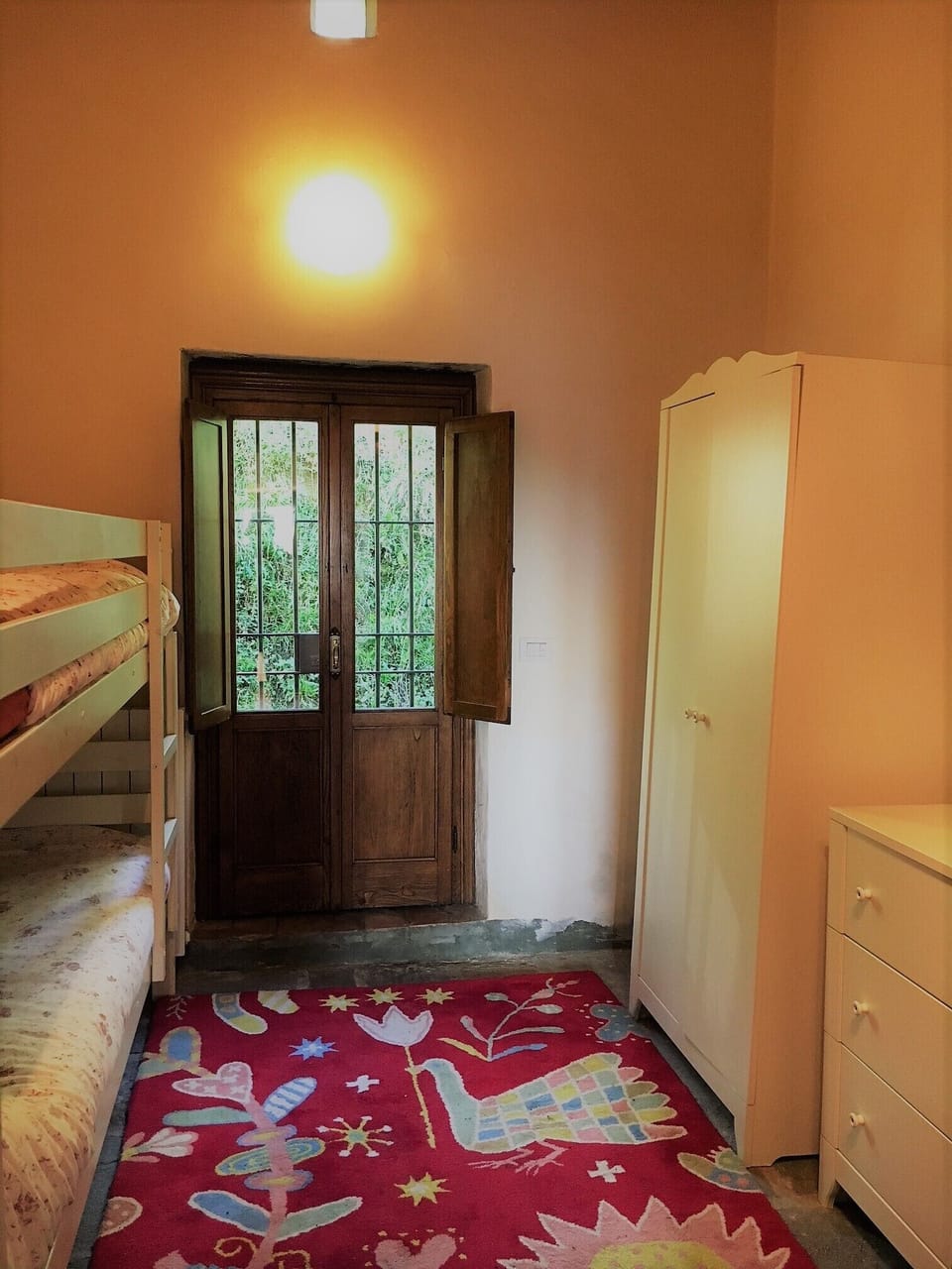 Third bedroom with bunk bed and French doors