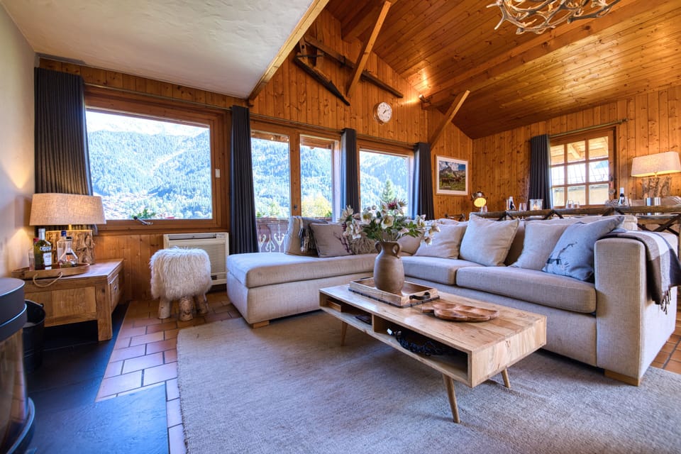 Large, comfortable main room with wood burning stove & lovely mountain views