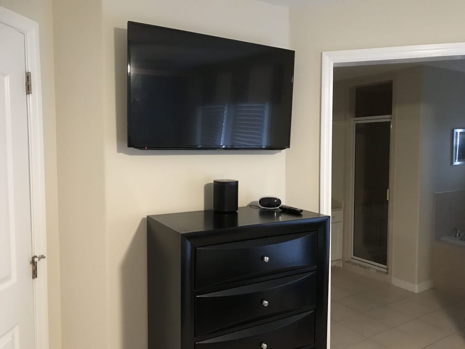 Blue Bedroom with LG soundplate DVD Player and Alexa Sonos music player.