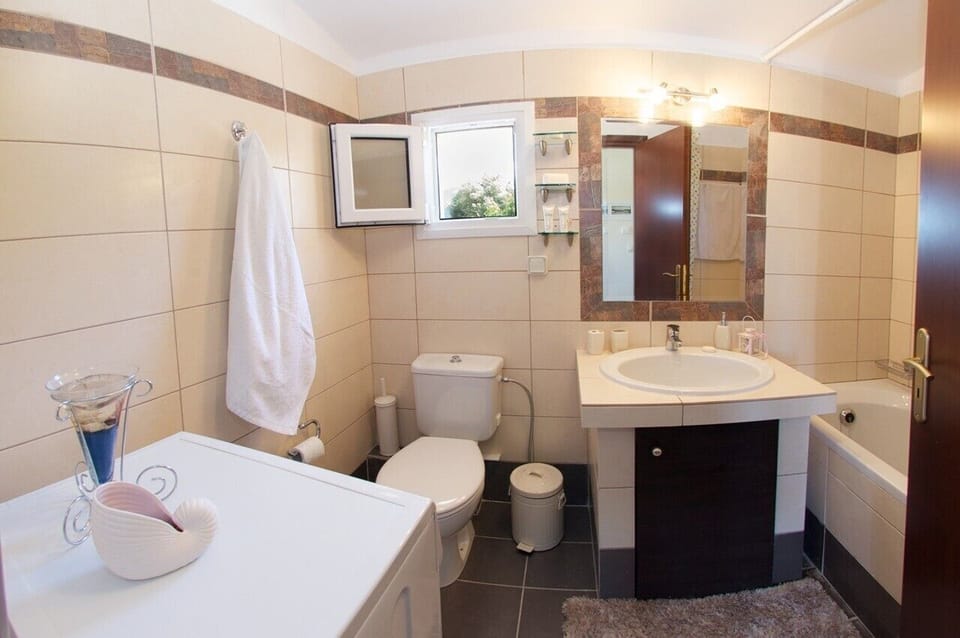 Modern family  bathroom with washing machine on the 1st floor