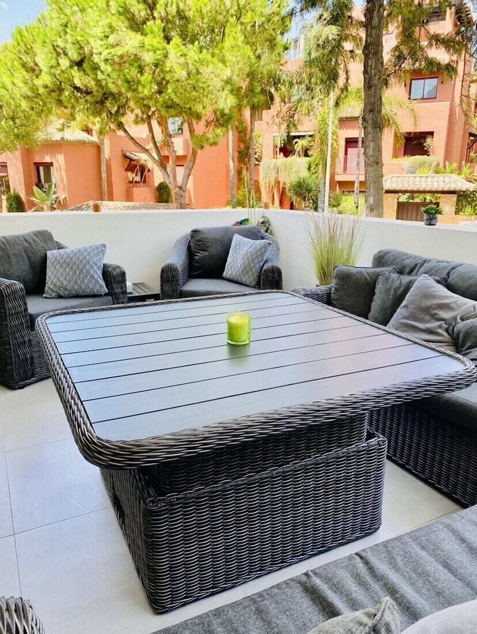 Large balcony with dining and seating. The beach is 150m away