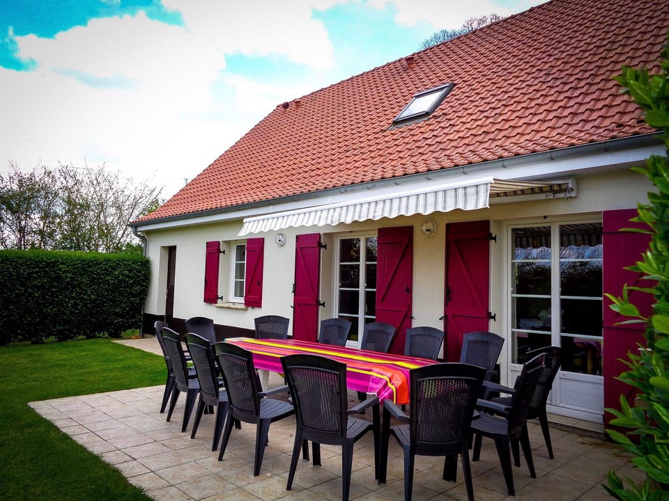 Sun terrace with BBQ and direct access to kitchen and dining areas.