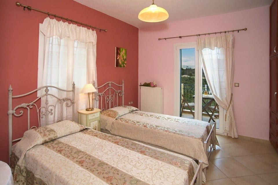 Single air conditioned bedroom with balcony overlooking  green valley and pool