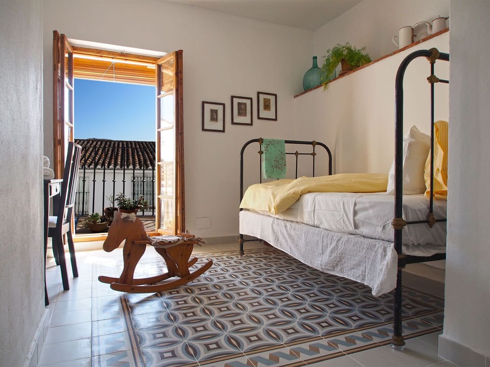 Single bedroom with balcony.