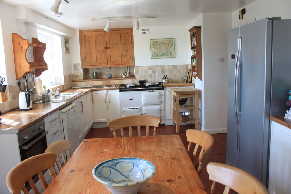 Kitchen with large table seating 8-9