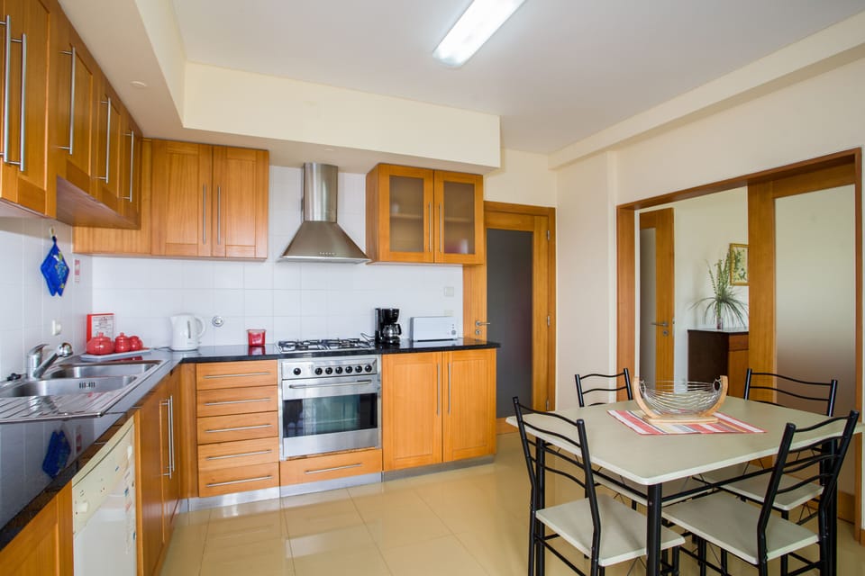 Kitchen and pantry with washing machine and dishwasher, fridge and microwave