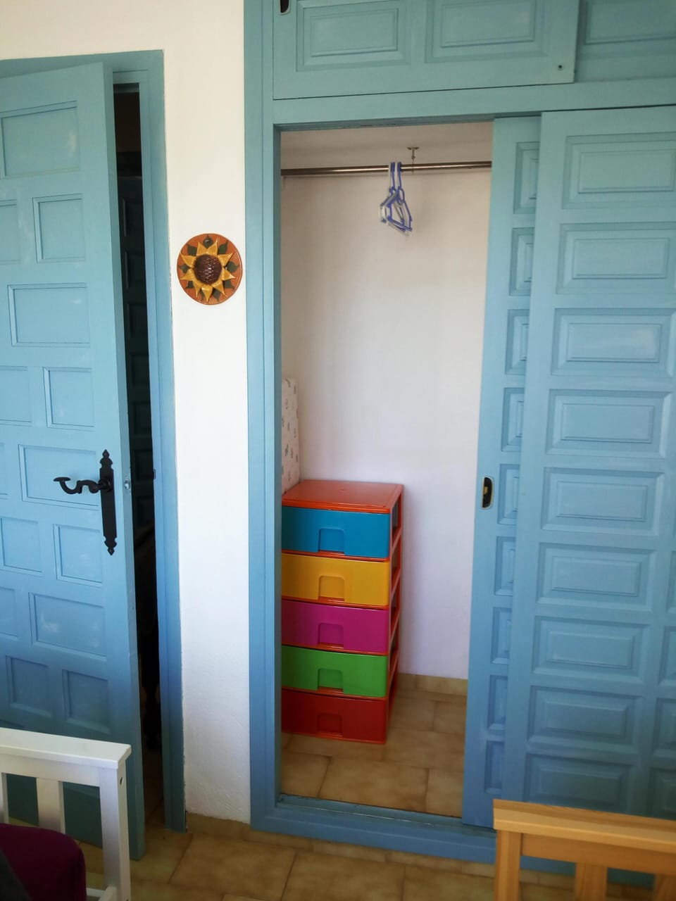 Bedroom two with 2 single beds and sliding door wardrobe.