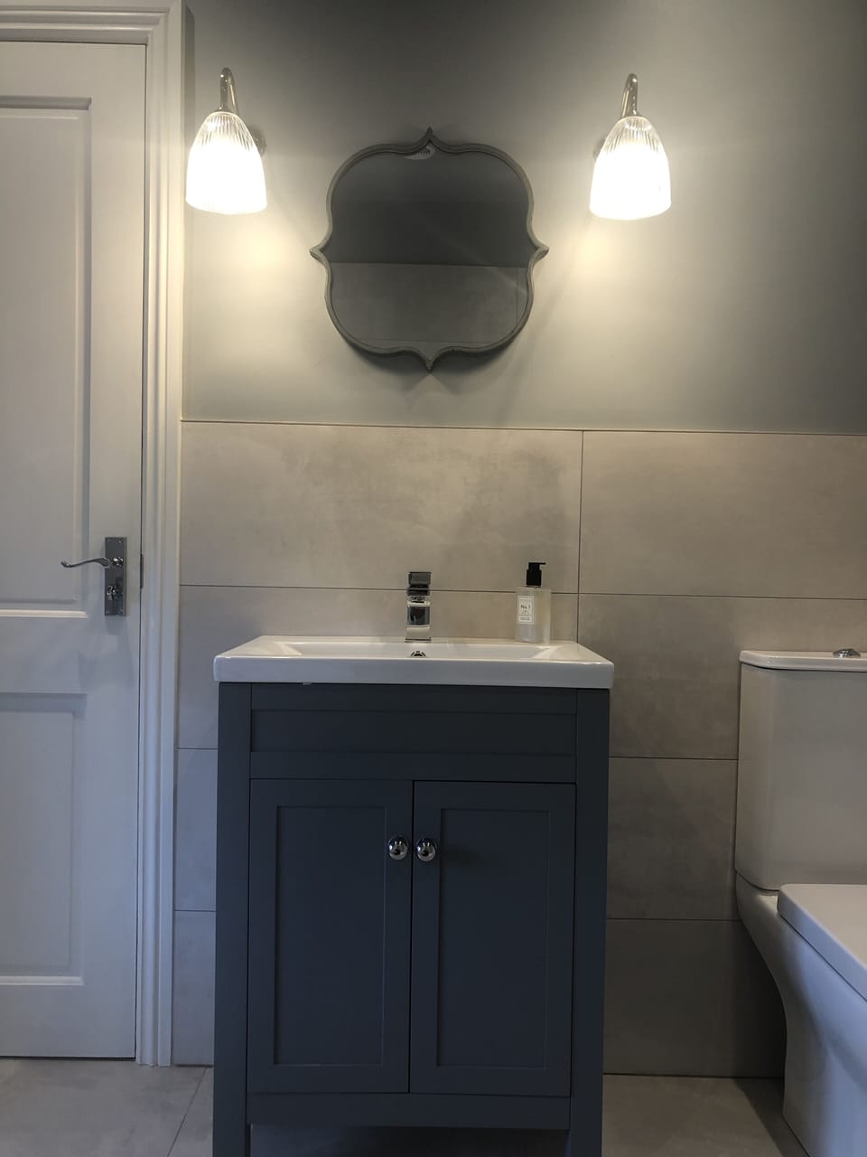 Pretty vanity sink in bathroom, with underfloor heating.
