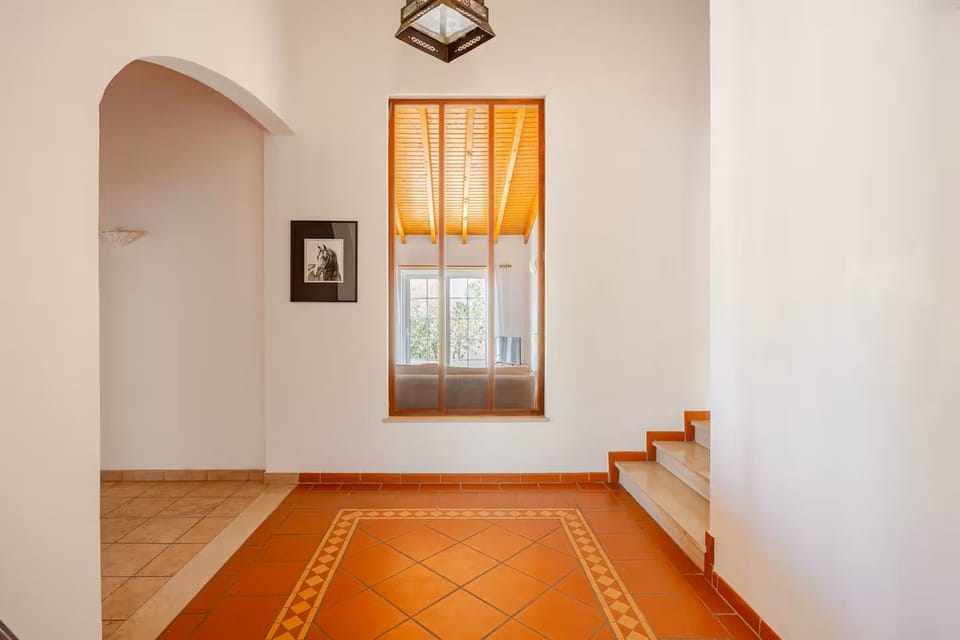 Bedroom with country views, feature ceilings and ample storage.