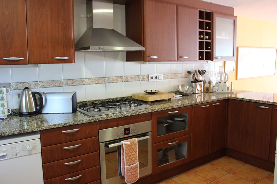 Well-equipped American-style kitchen, looking out over the dining/living areas