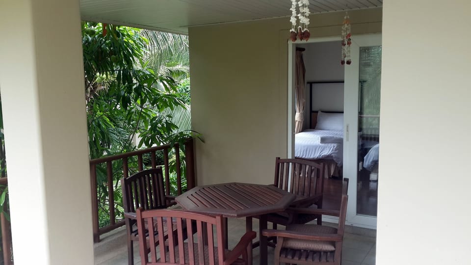 Balcony upstairs (front view over pool)