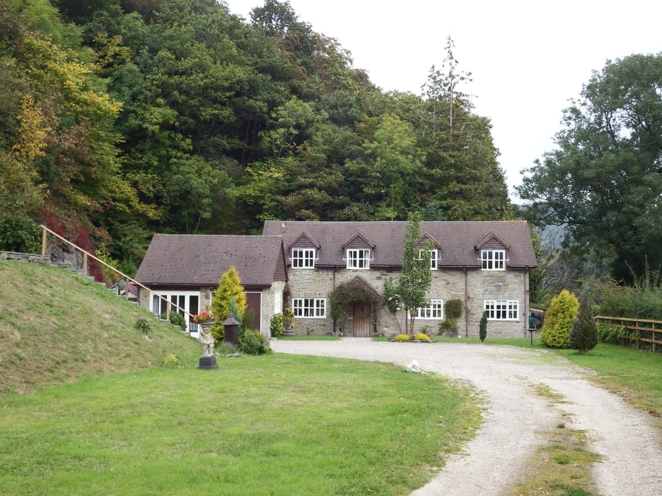 A peaceful rural retreat nestled at the base of Burfas Mound 