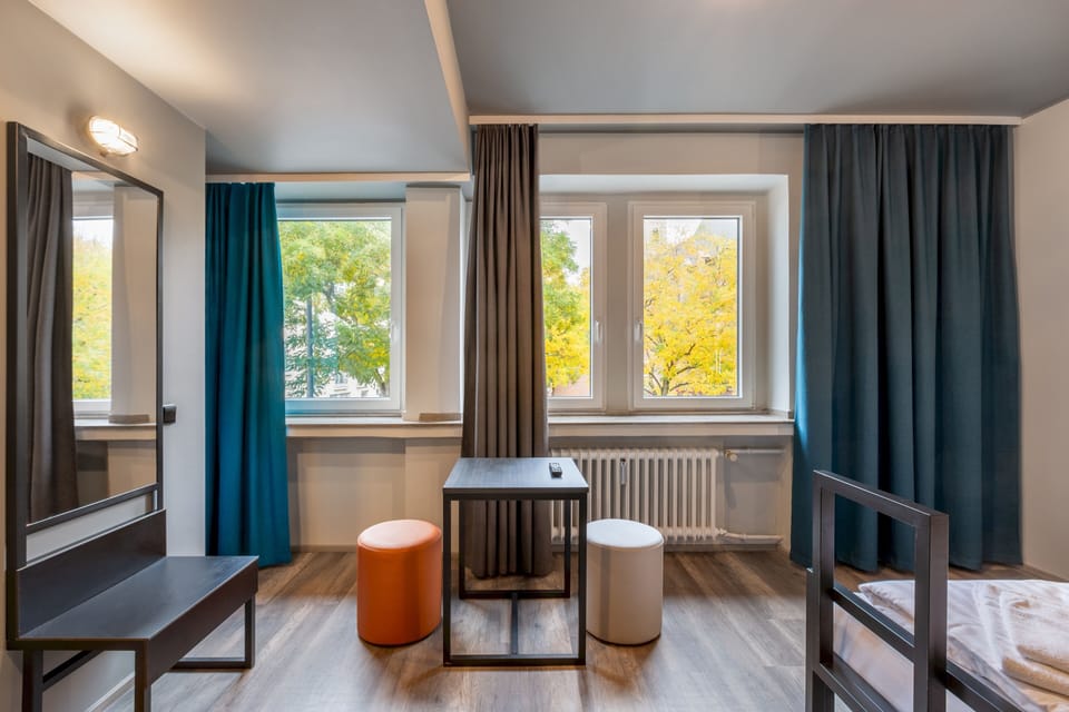 Twin Room | Desk, blackout drapes, iron/ironing board, free WiFi